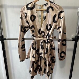 Cheetah print long sleeve dress with tiered skirt, deep V neckline.
